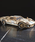 Endurance Racer 3D Wooden Puzzle Kit for Adults, DIY Mechanical Car Model With Realistic Transmission, Pistons, Suspension, and Radiator Fan, Wood Sports Car Brain Teaser and Epic Hobby Gift on black surface
