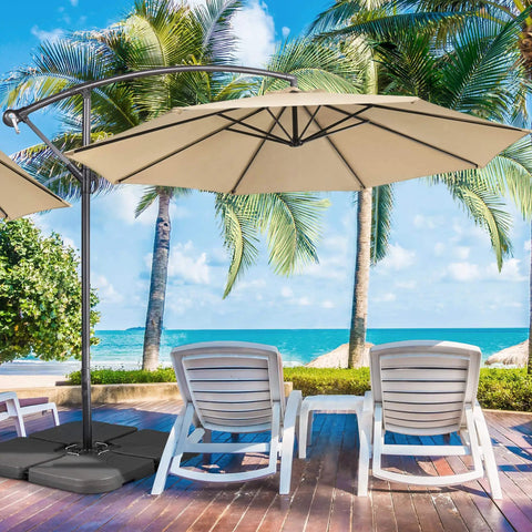 Heavy Duty 4 Piece 200Lb Beefy Cantilever Offset Umbrella Base fillable square pedestal on patio with beach backdrop