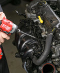 Mechanic using drill on car engine, illustrating use of Impact U Joint And Adapter Set For One Quarter, Three Eighths, And One Half Inch Drives With Two Adapters And Two Reducers, Beast Of A Heavy Duty Auto And Workshop Tool Kit For Hard To Reach Fasteners