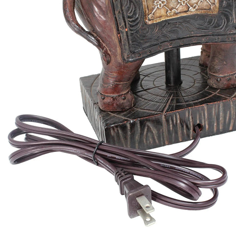 Close-up of brown resin base with plug for Festive Elephant Table Lamp In Brown With Gold Accent Resin Base And Brown Fabric Shade