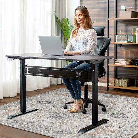 Woman sitting on 36x48 Inch Office Chair Mat For Hardwood And Tile Floors Under Desk, Grippy Non Slip Vinyl Floor Protector With Rubber Backing in home office.