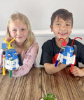 10 Pack Motorized Drawing Robots Kit For Kids Ages 8 And Up, Kid Friendly Easy To Build Scribble Bots With Simple Circuits That Move And Create Unique Artwork, Perfect Classroom Or STEM Club Project With Supplies For All 10 Builds; two kids holding bots