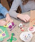 Children using Premium Natural Wood Craft Sticks For DIY Arts And Crafts, Non Toxic Ice Cream Sticks In A 1000 Pack at a table
