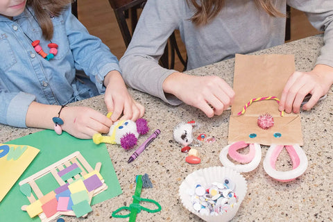 Children using Premium Natural Wood Craft Sticks For DIY Arts And Crafts, Non Toxic Ice Cream Sticks In A 1000 Pack at a table