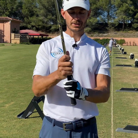 Golfer demonstrating Grip Alignment Training Golf Glove With Non Slip Silicone Palm For A Lockdown Swing, Medium Large Left Hand.