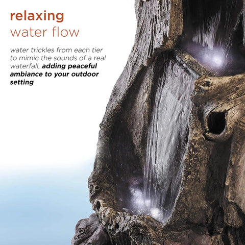 Close-up of flowing water on Outdoor Rainforest Waterfall Tree Trunk Floor Fountain With Led Lights, Tiered Garden Decor.