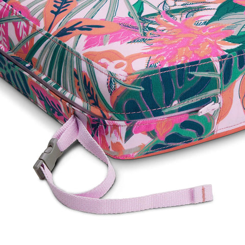 Close-up of Rain Forest Canopy Coral Water Resistant Patio Bench Cushion 48 By 18 By 3 Inches with strap detail