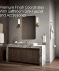 Modern bathroom with marble vanity, mirror, and brushed bronze fixtures including Archer Trip Lever for two-piece toilets.