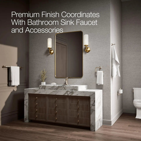 Modern bathroom with marble vanity, mirror, and brushed bronze fixtures including Archer Trip Lever for two-piece toilets.