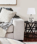 Welcome Home Rustic Ceramic Farmhouse Table Lamp With White Linen Shade, White Wash Ridged Base on living room side table