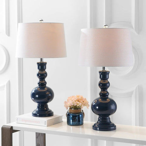 Pair of modern mercury silver glass table lamps with white linen shades displayed on a table.