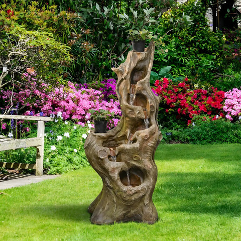 Outdoor 5 Tier Cascading Water Fountain With Realistic Tree Trunk Look, Resin Imitation Wood, LED Accent Lights in garden.