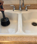 Person using Heavy Duty Toilet Plunger MP1003 with Patented Automatic Air Relief Valve in kitchen sink