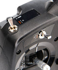 Close-up of DXS Transmitter With AR410 Receiver showing controls and ergonomic grip for precise fatigue-free RC control.