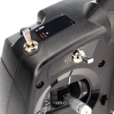 Close-up of DXS Transmitter With AR410 Receiver showing controls and ergonomic grip for precise fatigue-free RC control.