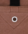 Close-up of the Rugged Workhorse 18 Oz Canvas Tarp showing rustproof grommet and stitching, industrial grade cloth in brown
