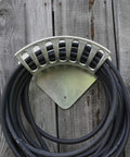 Heavy Duty 13 Inch Cast Aluminum Hose Rack For Outdoor Walls, Curved Wall Mount Hose Holder displayed on wood wall