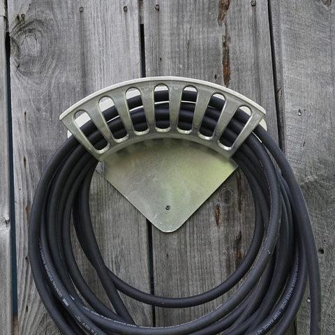 Heavy Duty 13 Inch Cast Aluminum Hose Rack For Outdoor Walls, Curved Wall Mount Hose Holder displayed on wood wall
