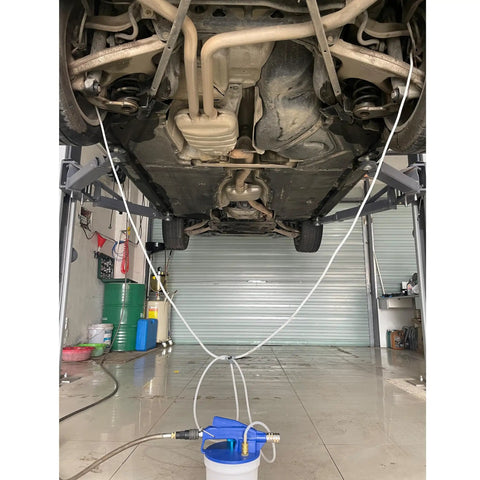 One Person Pneumatic Vacuum Brake Bleeder Kit With 2L Fluid Extractor And 1L Refilling Bottle used under a car lift