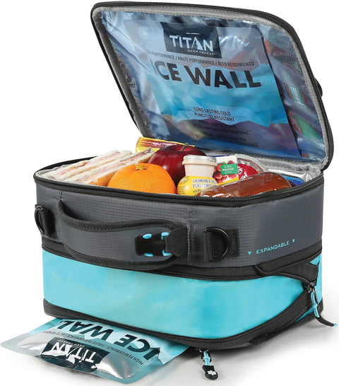 Heavy Duty Expandable Lunch Pack With Dual Food Containers And Pro Grade Ice Walls For Hella Superior Cooling And Zero Leak Stress In Smooth Black And Blue Travel Bag showing open top with food.