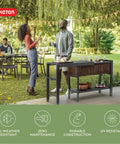 Extendable Outdoor Bar Cart With Hidden Cooler And Prep Surface in garden setting with people entertaining.