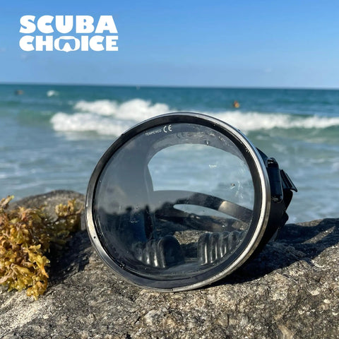 Free Dive Spearfishing Mask With Classic Rubber Finish And Tempered Glass Lenses Oval Stainless Steel Frame on rock