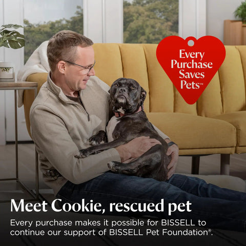 A man sitting on a yellow couch with a rescued dog named Cookie, promoting pet adoption and support for pet foundation.