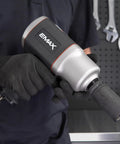 Close-up of EMAX 3/4 Inch Drive Air Impact Wrench, highlighting ergonomic grip for ease in mechanic work, designed for 1400 Ft Lbs Torque.