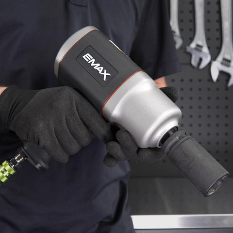 Close-up of EMAX 3/4 Inch Drive Air Impact Wrench, highlighting ergonomic grip for ease in mechanic work, designed for 1400 Ft Lbs Torque.
