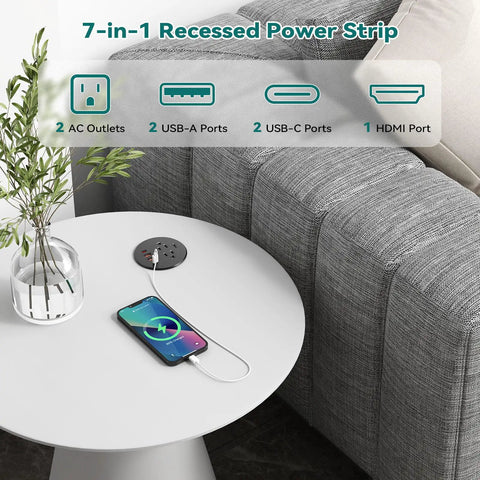 Flush Mount Desk Power Grommet With Two Outlet Jacks And Four USB Ports Including Dual PD Fast Chargers Plus HDMI Connectivity And A Low Profile Plug For Office Desks And Cabinets A Straight Up Game Changer For Slick Workspace Organization on a white table with a phone charging.