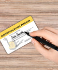 5 Pack Electric Pallet Jack Operator Credential Cards 2 By 3.5 Inch durable plastic card being filled out with a pen.