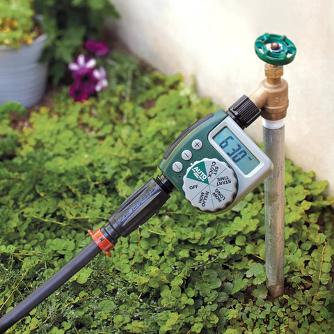 Image of a garden faucet with 3-In-1 Drip Irrigation Faucet Adapter With Filter, Pressure Regulator And Drip-Lock, hose connected.