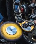 9-Inch Buffing Wheel For Metal Polishing Aluminum And Stainless Steel With Aluminum Oxide Grit in use on a vehicle wheel