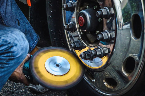 9-Inch Buffing Wheel For Metal Polishing Aluminum And Stainless Steel With Aluminum Oxide Grit in use on a vehicle wheel