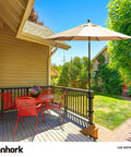 Heavy Duty 304 Stainless Steel Patio Umbrella Holder Built Tough For Outdoor Fixed Deck Railing And Grille Posts Black Base And Bracket Rugged Sun Umbrella Support For Your Deckside Hangouts securely mounted on wooden deck with umbrella creating shade over table and chairs.