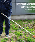 Person using 2 In 1 Garden Hoe And Weed Puller Rake With 60 Inch Adjustable Long Handle in garden