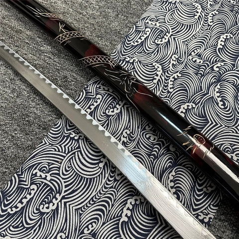 Close-up of a sword blade and sheath from Red 3 Piece Samurai Sword Set With Display Stand Katana Collection Decorative Swords.