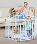 Child in Royale Converta 3 In 1 Play Yard And 151 Inch Wide Baby Gate, 6 Configurable Panels, 29 Inch Tall, in living room