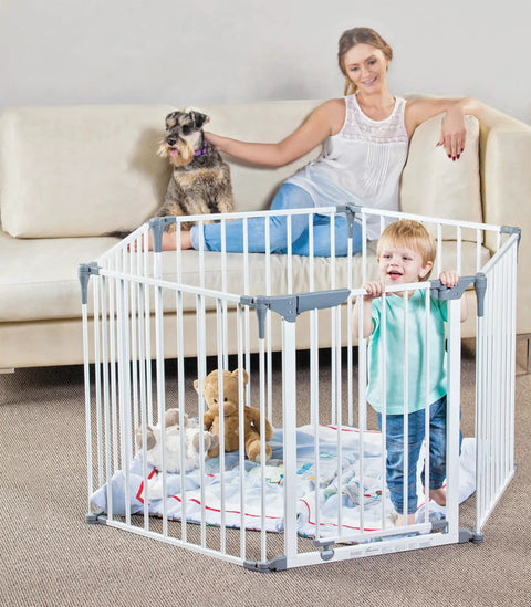 Child in Royale Converta 3 In 1 Play Yard And 151 Inch Wide Baby Gate, 6 Configurable Panels, 29 Inch Tall, in living room