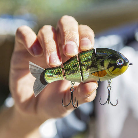 Hand holding Mike Bucca Baby Bull Gill Swimbait, 3.75 Inch, Three Quarters Ounce Ruby Gill