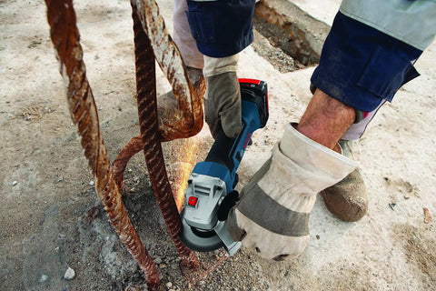 18V Cordless Angle Grinder 4-1/2 Inch Bare Tool with all-day power cutting rebar on job site.