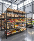 Beefed Up Heavy Duty Storage Shelves With Adjustable Height, 3200 Lb Capacity, 55.5 Inch Wide By 18 Inch Deep By 71 Inch High Industrial Shelving For Garage, Warehouse, Kitchen And Office, Maximizes Vertical Space And Cuts Storage Costs. Black metal shelving stocked with baskets, boxes, jars, fruit, and bottles in a store.