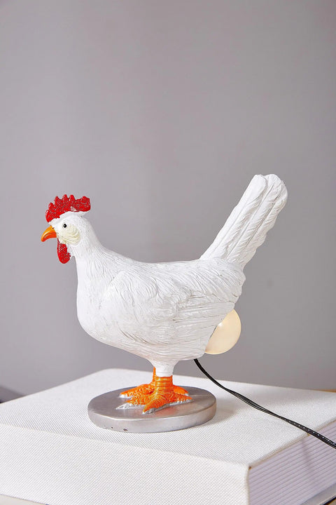 Lit 3D Lifelike Chicken Egg Lamp Night Light, resin egg table lamp USB, white chicken design on a stack of books