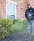 Person using Spyker 25Lb Bag Spreader With Material Viewing Window And Easy Calibration System Built For The Lawn And Farm