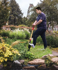 Man using 45 Inch Transplanting Spade For Digging And Planting With Steel D Grip And Wooden Handle in garden