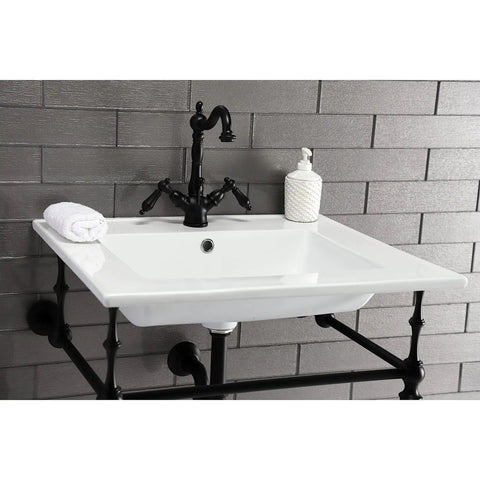 Heritage Matte Black Two Handle Bathroom Faucet with brass pop-up drain on white sink in classic bathroom setup