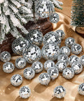 65 Pcs Mirror Disco Balls Set for Hanging Decor in Assorted Sizes 3cm 5cm 6cm 8cm Silver Party Ornaments displayed on gold fabric