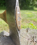 A hatchet with a wood handle featuring a T-80 barbed steel wedge for secure fit, exemplifying 15 Pack Steel Handle Wedges For Hammers, Hatchets, And Axes, Sure-Hold T-80 Barbed Wedges That Prevent Loosening, Hammer In, File Smooth, Quick Tight Fit For Loose Wood Handles And Tools That Last For Years installed.