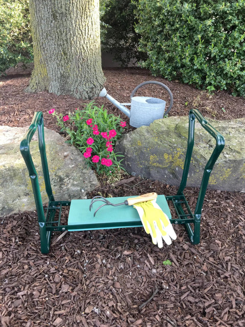 Folding Kneeler Garden Bench And Seat For Yard Work, sturdy arms for easy standing, foam padding, green metal frame in garden