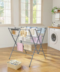 Heavy Duty Indoor Clothes Drying Rack With Twelve Solid Horizontal Rods And Tight Grip Sock Clips efficiently air dries laundry in a bright room.